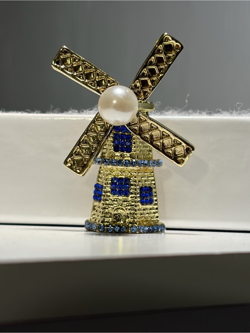 Gold-Tone Windmill Pin with Blue Crystals and Pearl Accent